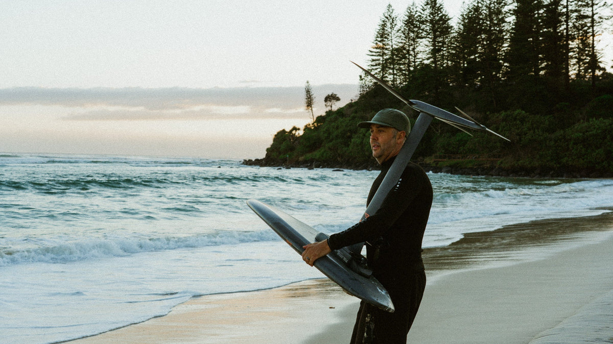 Follow founder Steve Anderson heading out for a seesion on his Foil Drive in the Follow P1 Oceana Wetty Top and Follow Welded Boardie in Black