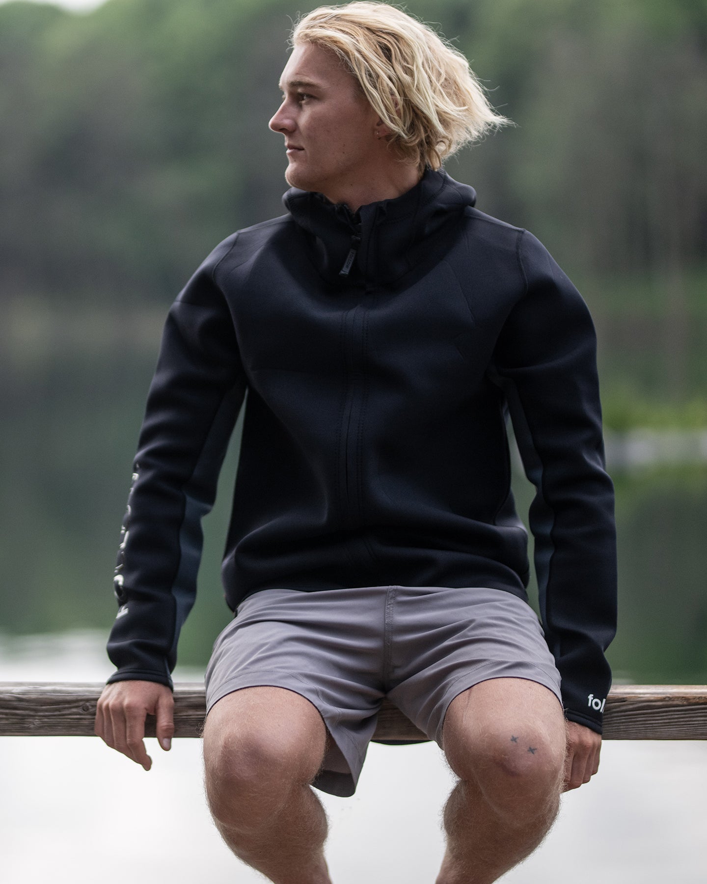 JOe Battleday wears the Follow Company Neoprene Jacket to stay warm between sets and keep wind chill at bay 