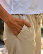 Follow Amora Pant - Cream — women's watersports pant, lifestyle view 12