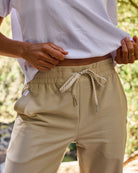 Follow Amora Pant - Cream — women's watersports pant, lifestyle view 13